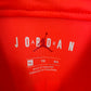 Close-up of PSG club crest and Nike swoosh logo on 2019/20 away shirt front panel