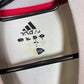 Close-up of Adidas logo and Japan national team badge on 2002 away shirt with Inamoto details