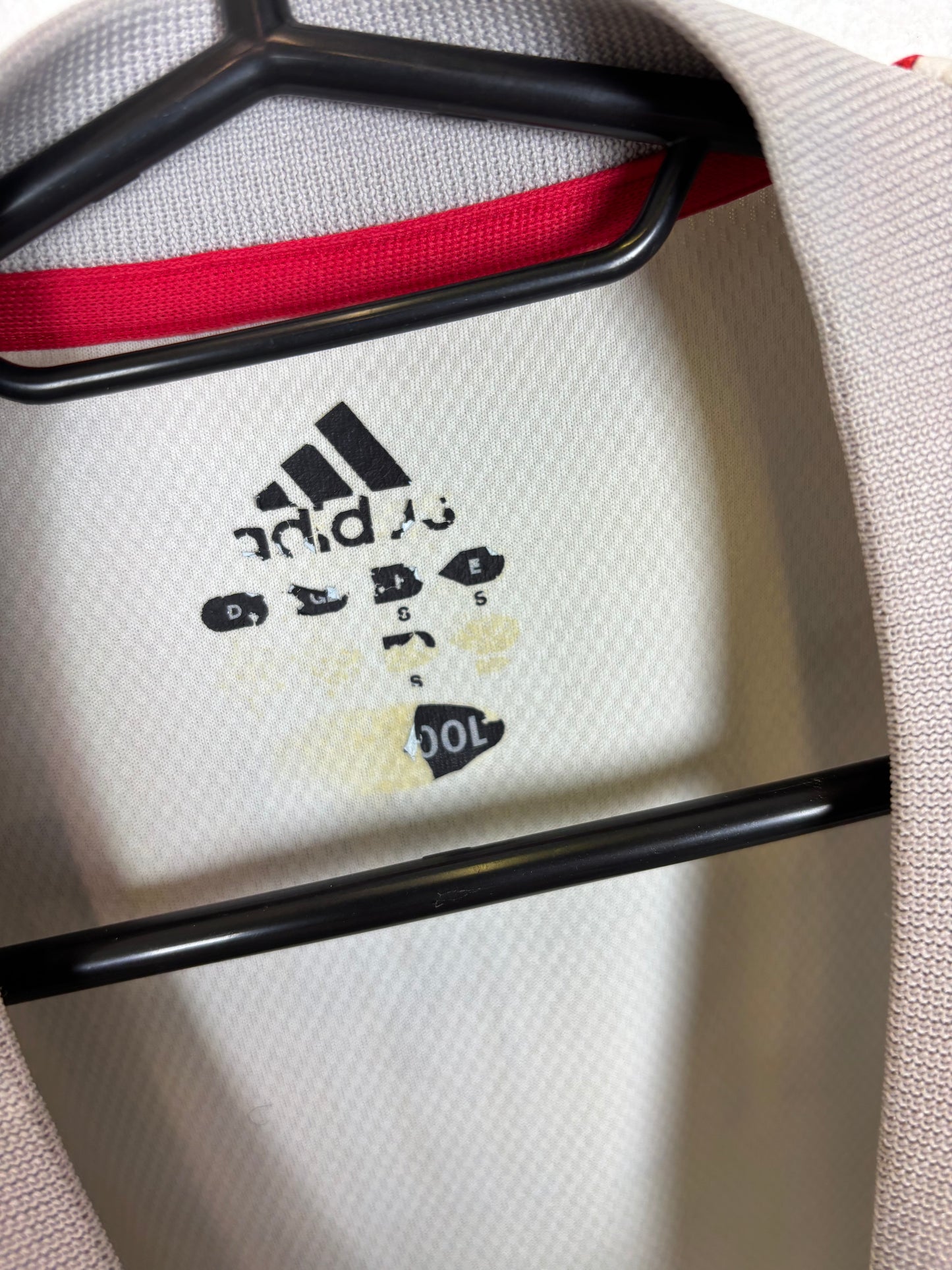 Close-up of Adidas logo and Japan national team badge on 2002 away shirt with Inamoto details