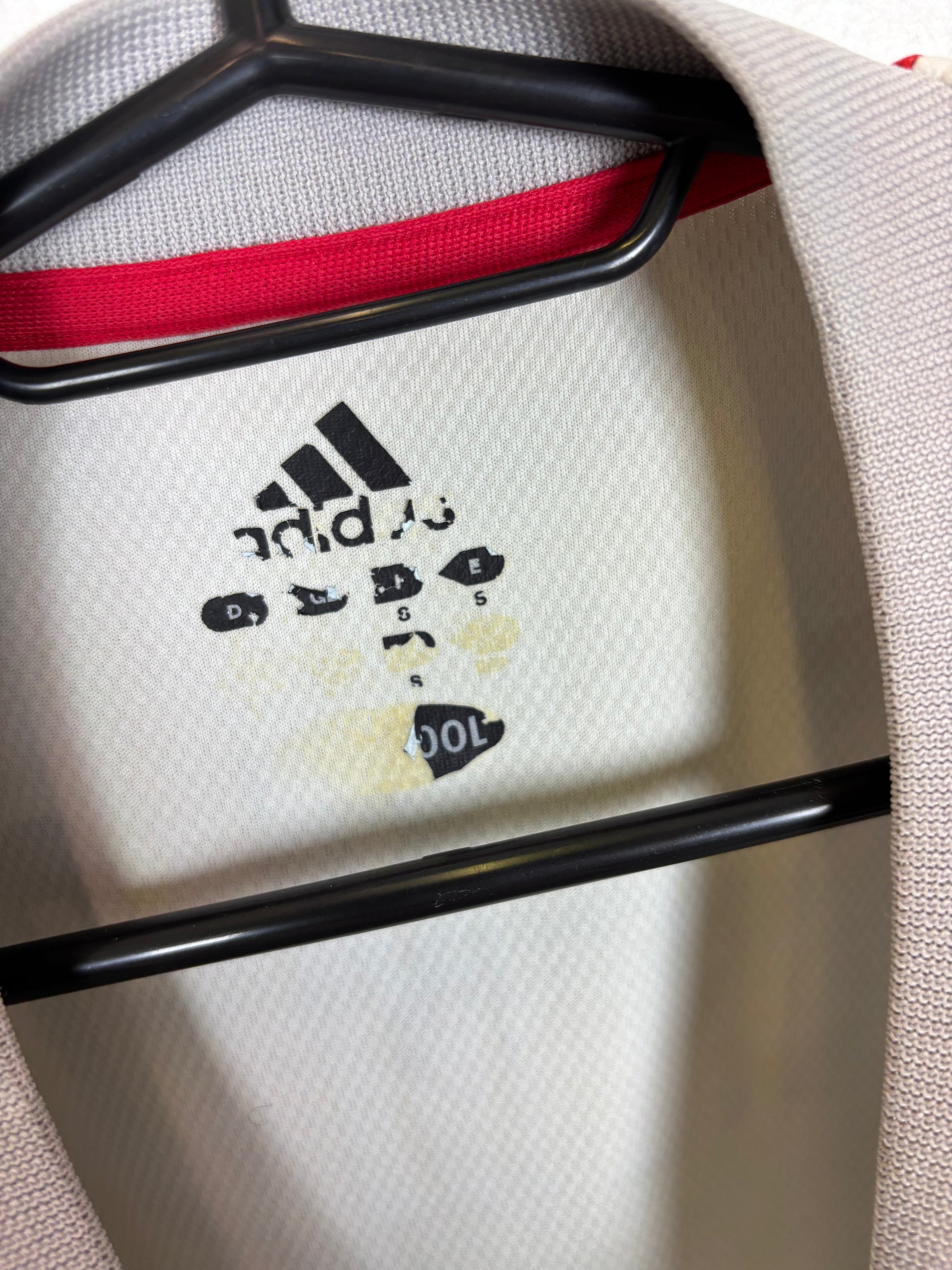 Close-up of Adidas logo and Japan national team badge on 2002 away shirt with Inamoto details