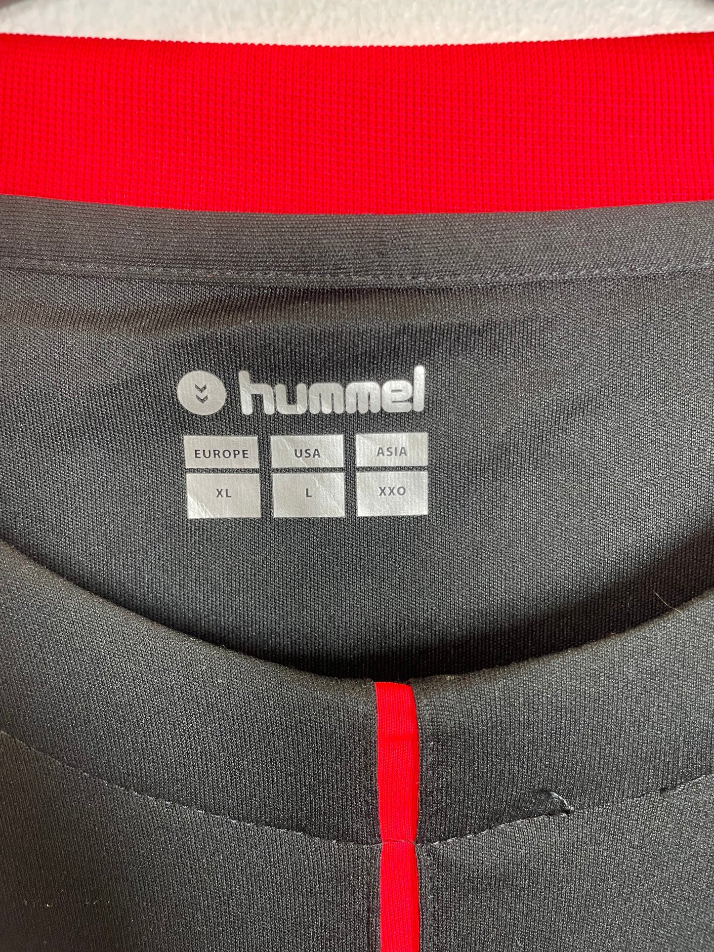 Close-up of Hummel logo and CD Tenerife club badge on 2018/19 third kit in XL