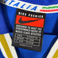 Close-up of Nike logo and Italy national team badge on 1996 blue home shirt with Nesta 6