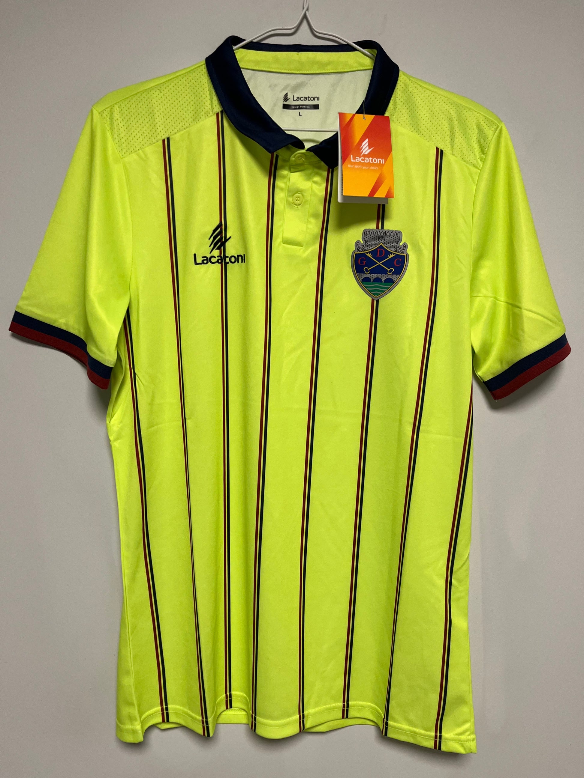 Portuguese Primeira Liga jersey with black accents and a brand logo on a gray background