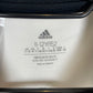 Close-up of Adidas three stripes logo and Juventus club crest on kids 22/23 home jersey