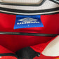 Close-up of Manchester United club badge and Umbro logo on red 98/00 home shirt with Beckham 7
