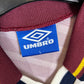 Close-up of Manchester City club badge on Umbro 1996/97 away shirt chest