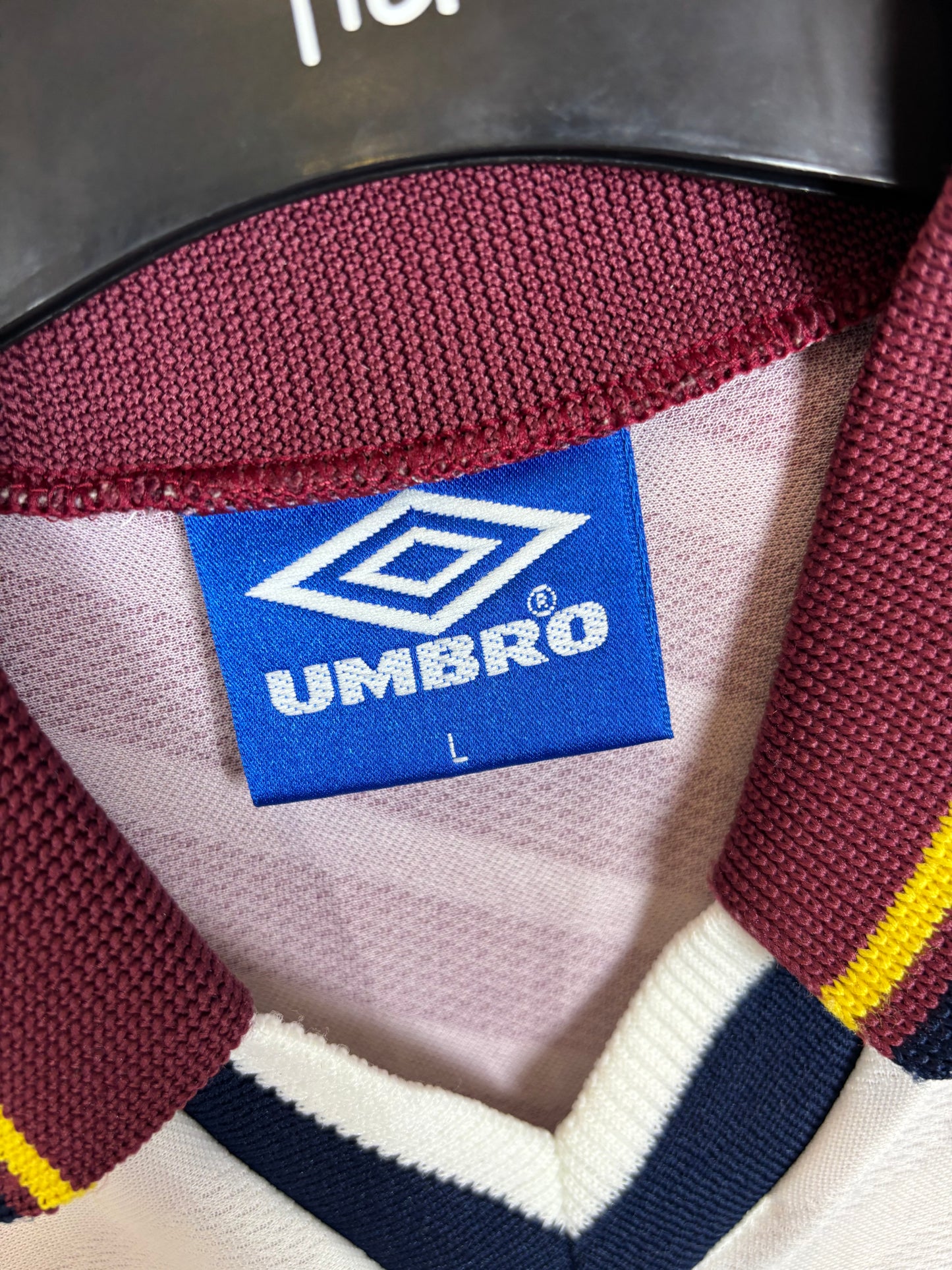 Close-up of Manchester City club badge on Umbro 1996/97 away shirt chest