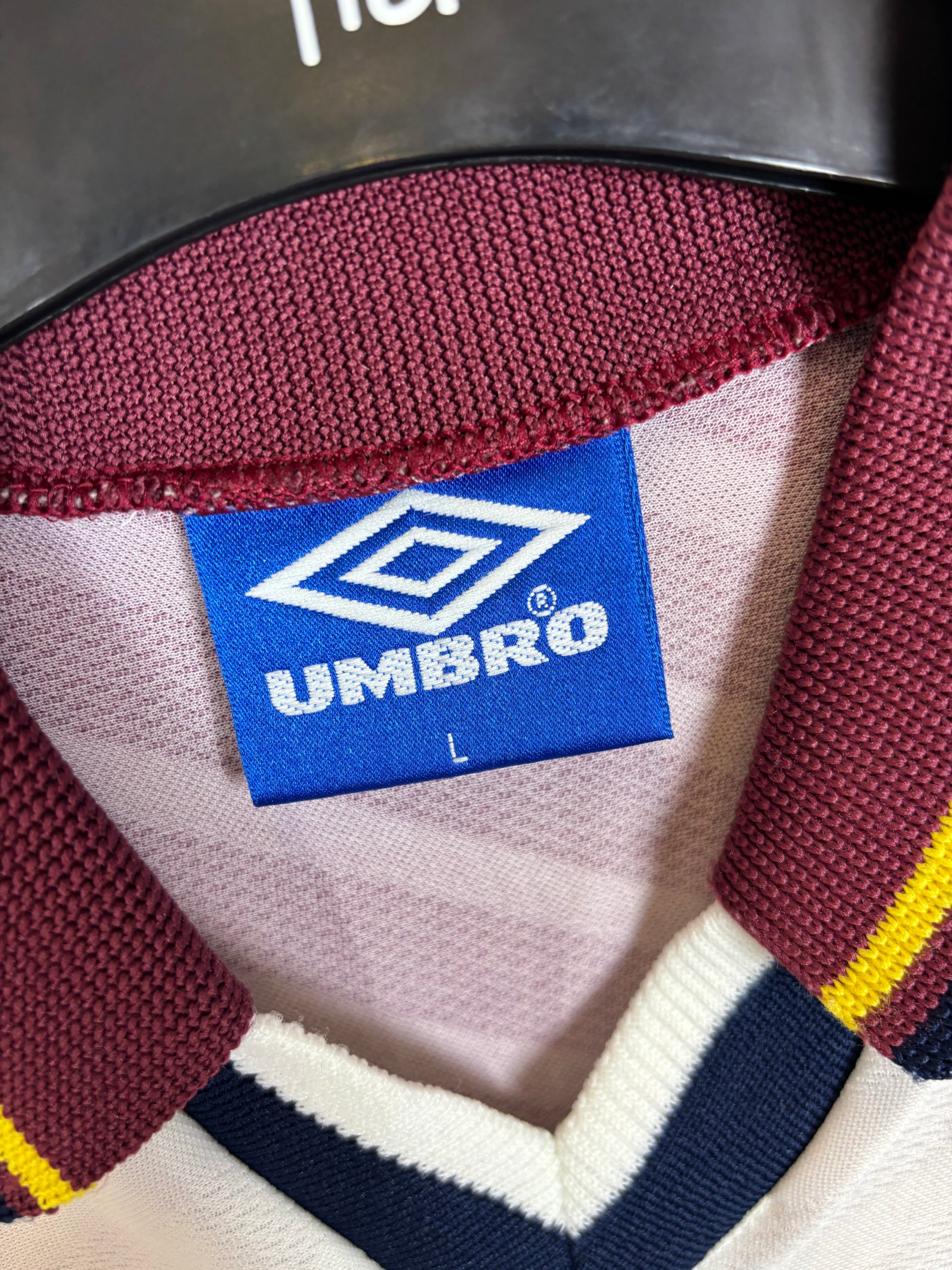 Close-up of Manchester City club badge on Umbro 1996/97 away shirt chest