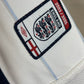 Close-up of England 2003-05 home shirt fabric texture and Umbro construction details
