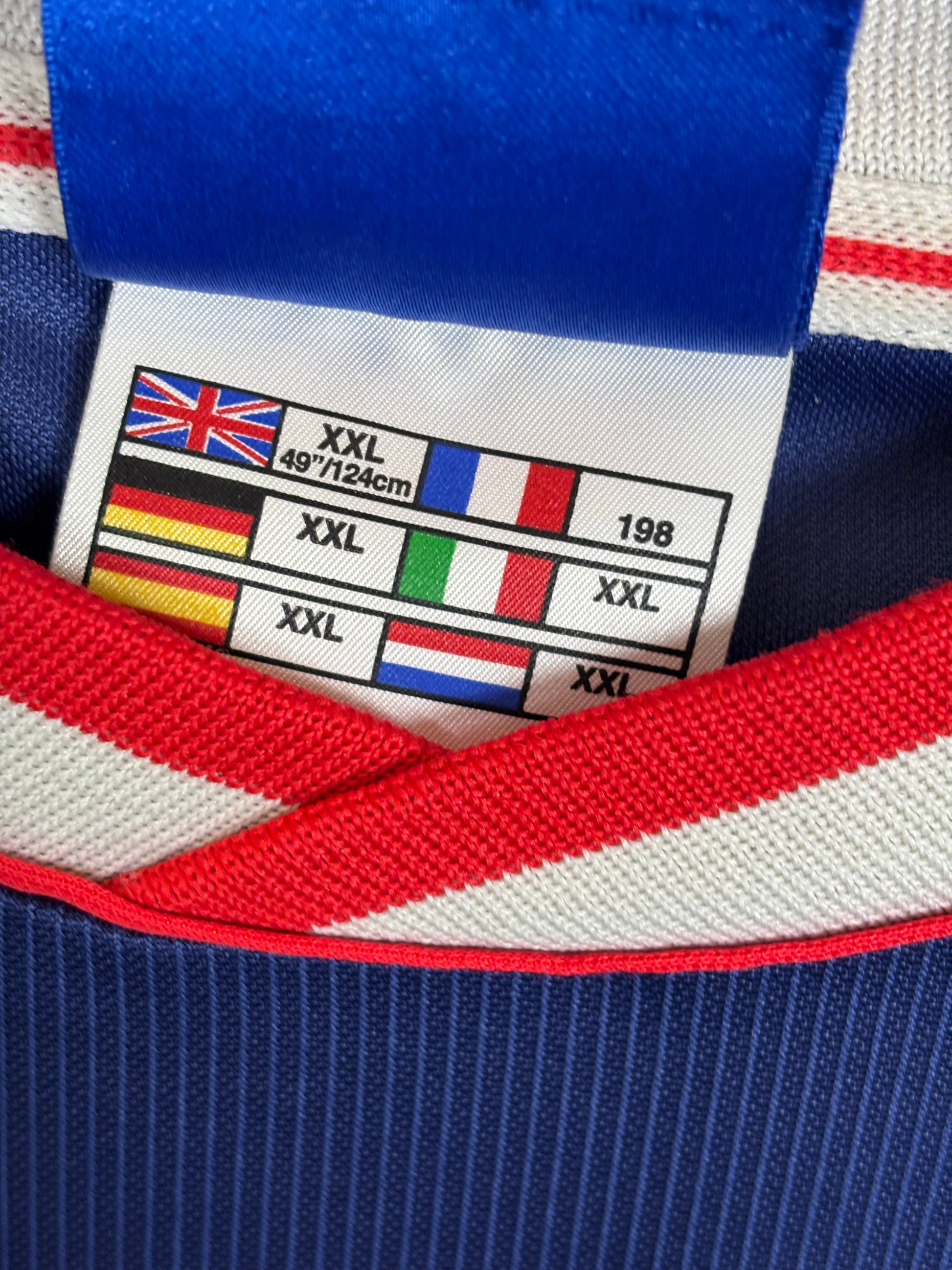 Interior sizing label and Umbro branding tags visible inside Ajax 99/00 away shirt XXL