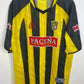Optimus The Strongest Bolivia home shirt — front view in yellow and black Chayñita stripes