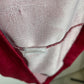 Close-up of a fabric edge with a visible seam and label.