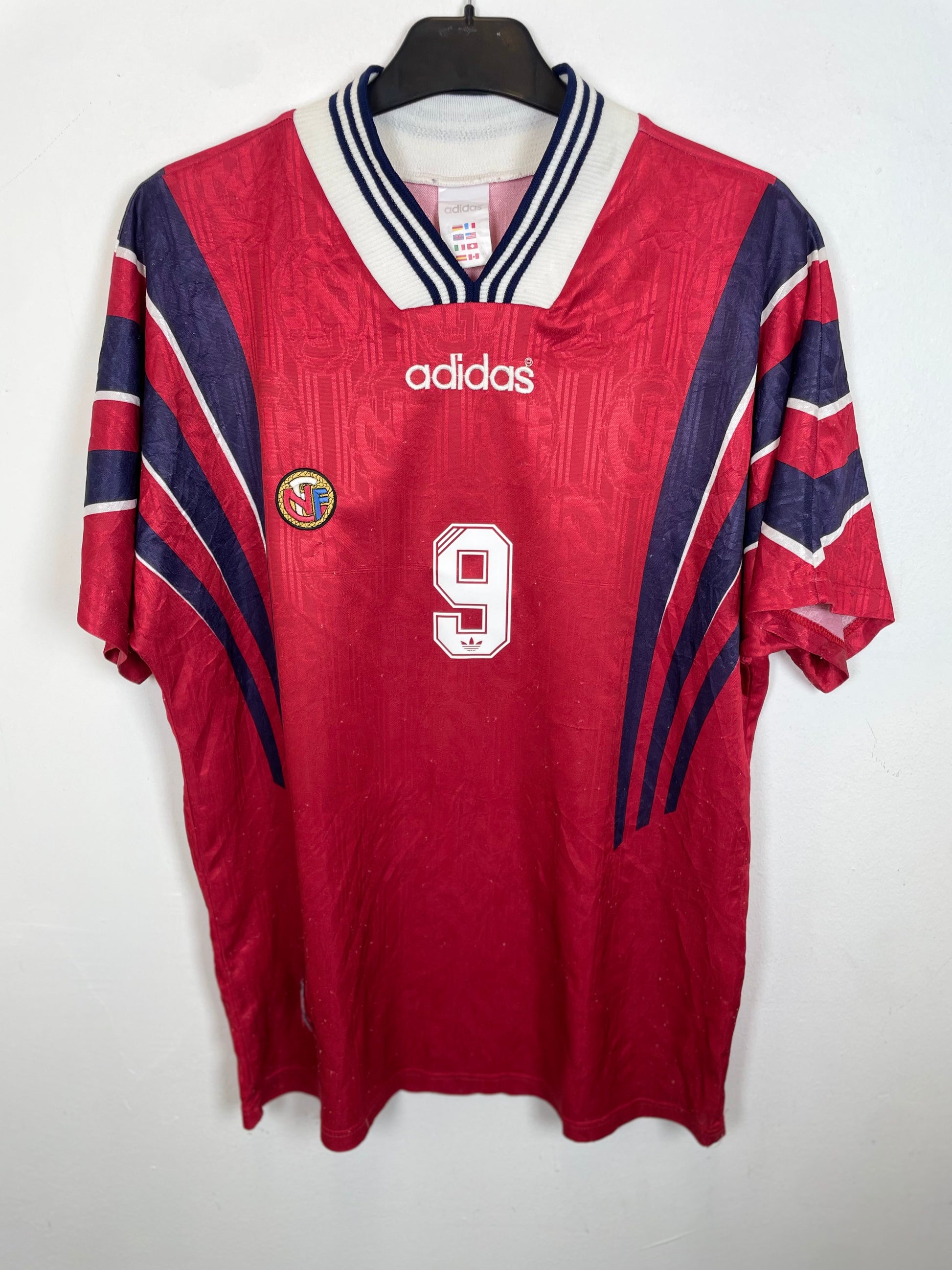 Adidas Norway home football shirt from 1996 in red with white trim, front view showing team badge and sponsor