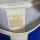 Close-up of a sports jersey with a brand logo on the collar.