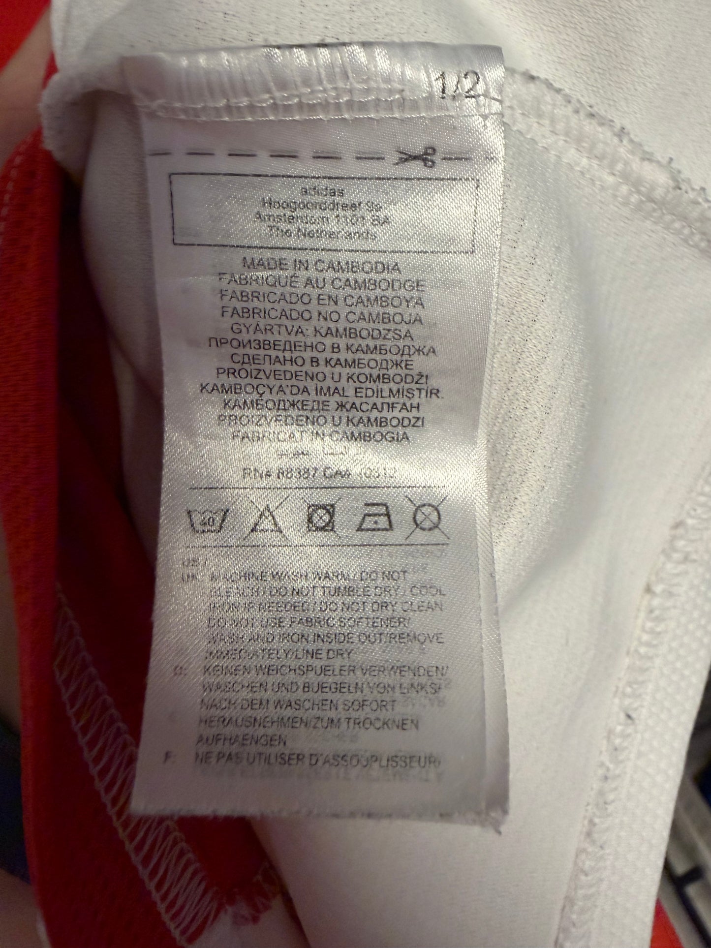 Interior size label and care instructions of Adidas Ajax 21/22 Haller home jersey