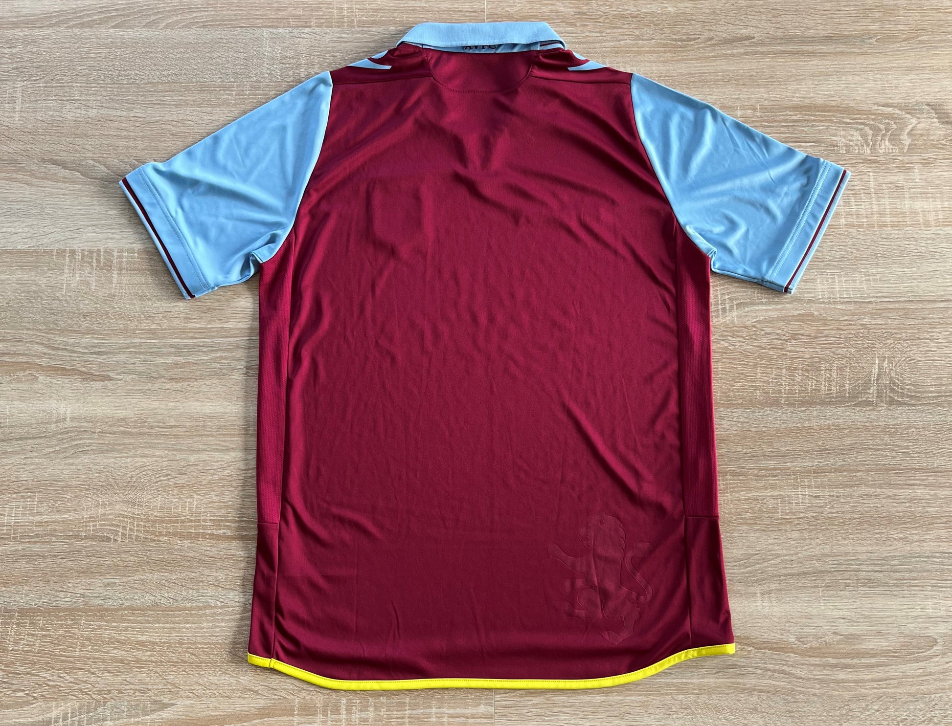 Aston Villa Home Shirt from 2012-2013: The home jersey worn by Aston Villa during the 2012-2013 season. This shirt features the club's emblem and captures the essence of the team's performance and commitment throughout that memorable period.