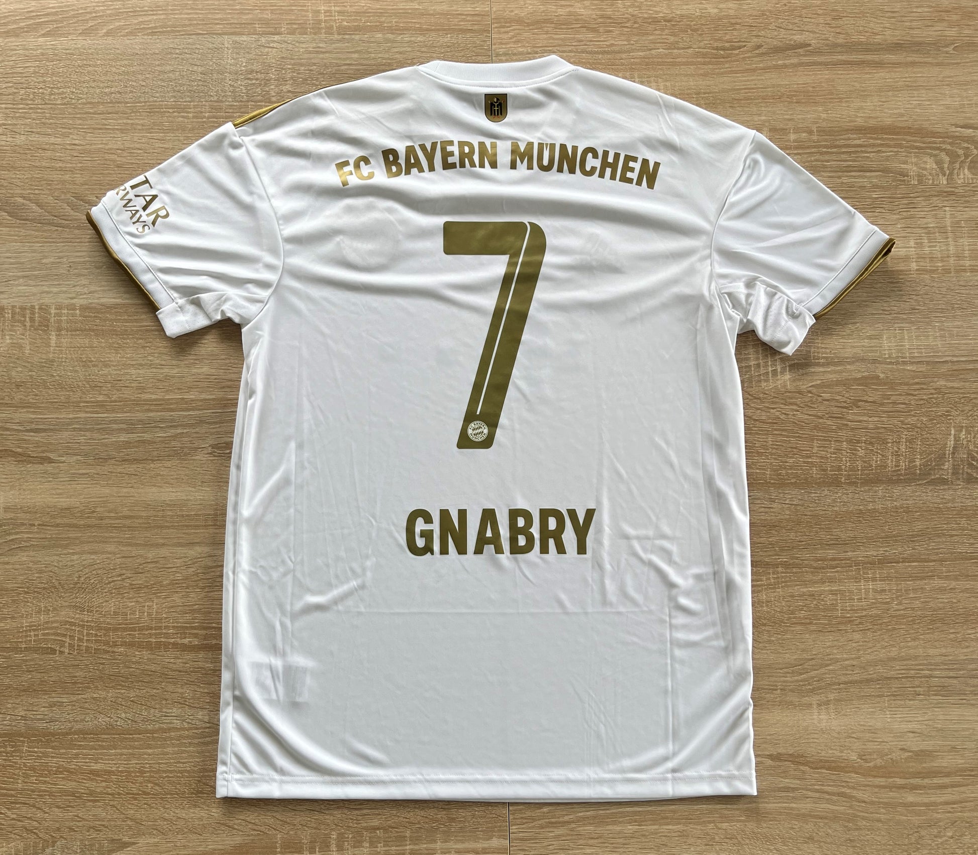 Bayern Munich Away Shirt from 2022-2023: Worn by Gnabry with the number 7, this jersey represents Bayern Munich's away kit during the 2022-2023 season. Featuring a unique design and the club's emblem, it symbolizes the team's identity and performance on the field.