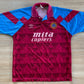Aston Villa Home Shirt from 1990-1992: The classic home jersey worn by Aston Villa during the 1990-1992 period. Featuring the club's emblem and a traditional design, this shirt captures the essence of the team's representation and efforts on the field during that specific era.