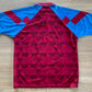 Aston Villa Home Shirt from 1990-1992: The classic home jersey worn by Aston Villa during the 1990-1992 period. Featuring the club's emblem and a traditional design, this shirt captures the essence of the team's representation and efforts on the field during that specific era.