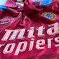 Aston Villa Home Shirt from 1990-1992: The classic home jersey worn by Aston Villa during the 1990-1992 period. Featuring the club's emblem and a traditional design, this shirt captures the essence of the team's representation and efforts on the field during that specific era.
