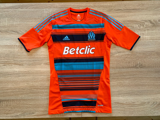 Olympique Marseille Third Shirt from 2011-2012: Worn by Gignac with the number 10, this Techfit jersey represents Marseille's alternate kit during the 2011-2012 season. Featuring a unique design, it showcases the team's style and Gignac's contributions on the field.