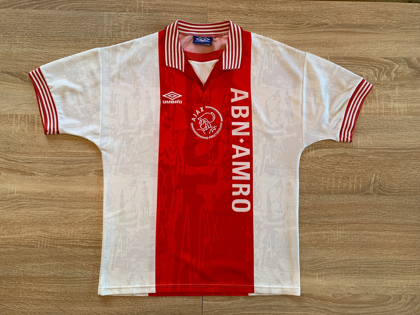 Ajax Home Shirt from 1996-1997: The iconic home jersey worn by Ajax during the 1996-1997 season. Featuring the club's emblem and a classic design, this shirt encapsulates the team's history and performances during that memorable period