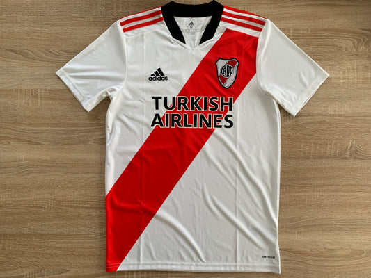 River Plate Home Shirt from 2021-2022: Worn by Alvarez with the number 9, this jersey represents River Plate's home kit during the 2021-2022 season. Featuring the club's emblem, it symbolizes the team's identity and Alvarez's presence on the field.