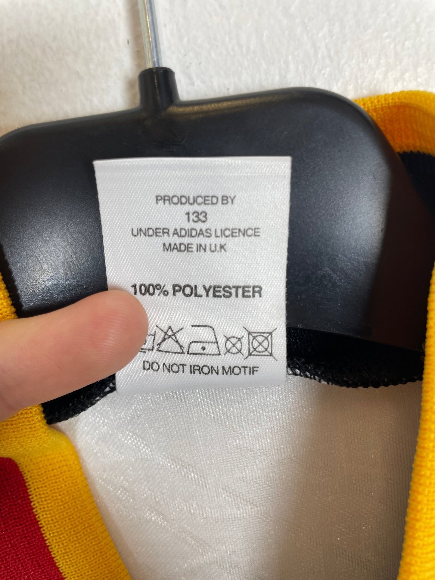 Close-up of the Germany national team crest on the original 1994 banded World Cup shirt, shown in close detail