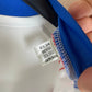 Close-up of the Italy national team crest and Adidas logo on the 24/25 away shirt, shown in close detail from Norway