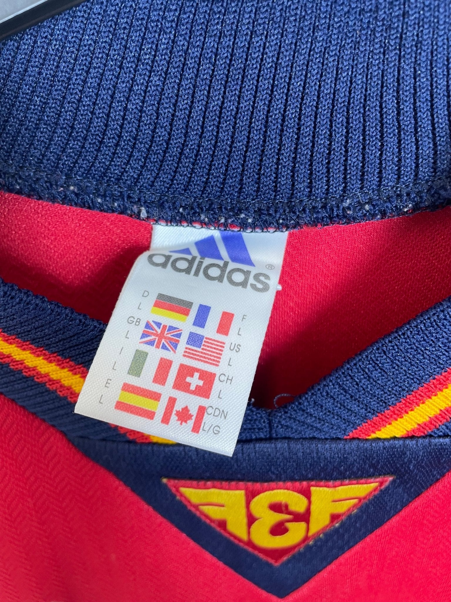 Back of the vintage Spain 1998 Adidas home shirt with the Luis Enrique number 21 print, shown in full rear detail