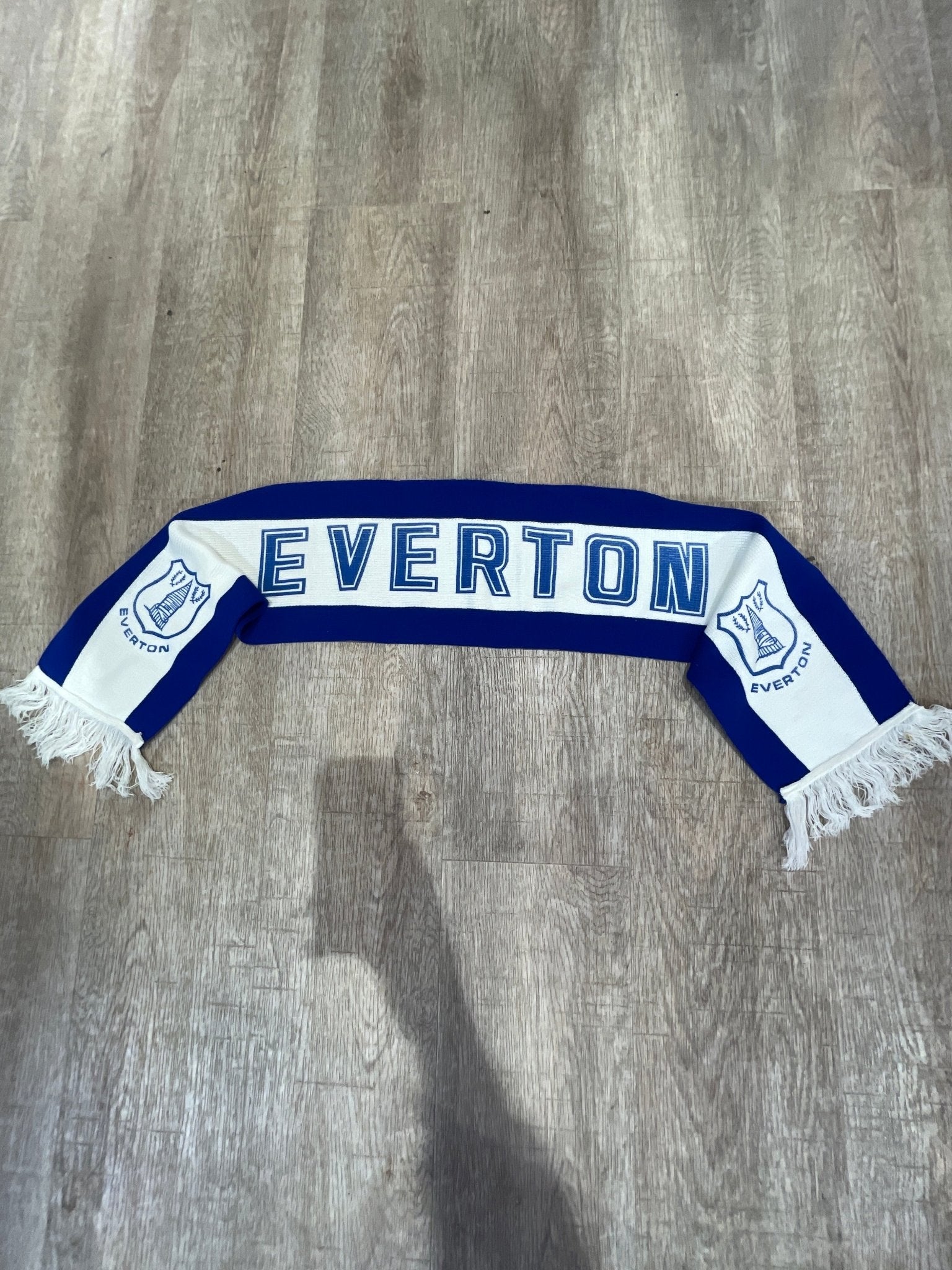 Everton scarf with traditional red-white-red colors and team branding, supporter accessory