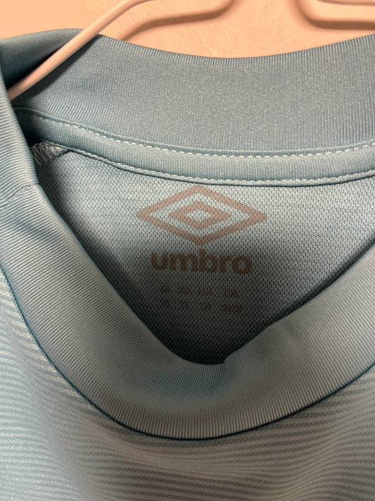 Front view of the Burnley 22/23 kids away shirt showing the club badge and Umbro branding, shown in full front detail
