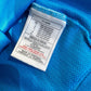 Close-up of the PSV Eindhoven crest and Nike logo on the original 02/03 away shirt, shown in close detail from Norway