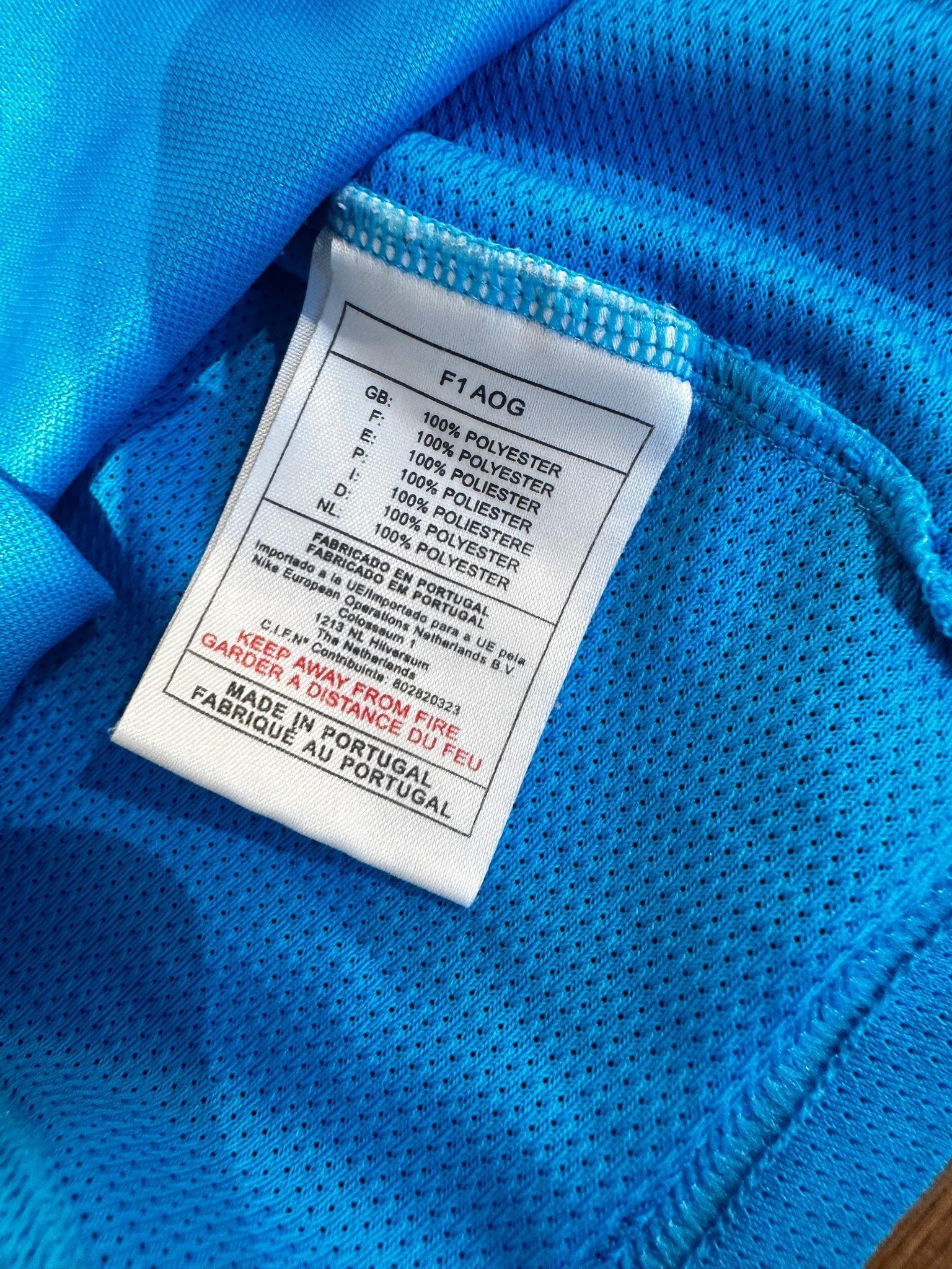 Close-up of the PSV Eindhoven crest and Nike logo on the original 02/03 away shirt, shown in close detail from Norway