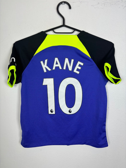 Front view of the Spurs 22/23 Kane kids away shirt showing the club badge and Nike swoosh, front detail shown here