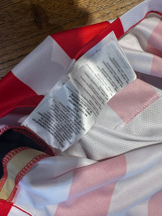 Side view of the Umbro PSV Eindhoven 15/16 kids home shirt showing the striped sleeve detail, photographed at our Stavanger store