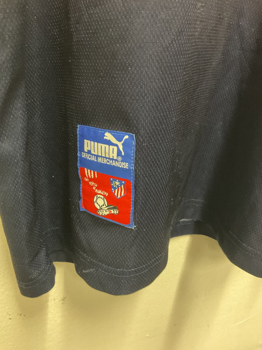 Side view of the vintage Puma Atletico Madrid 97/98 away shirt showing the sleeve detailing, photographed at our Stavanger store