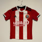 Official Sheffield United 2019/20 home shirt in red and white stripes, kids size 7-8 years, genuine original football shirt