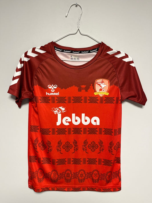 Thimphu City 2021 home football shirt in kids size 3XS with the Bhutanese club crest, graded by hand and shipped from Norway