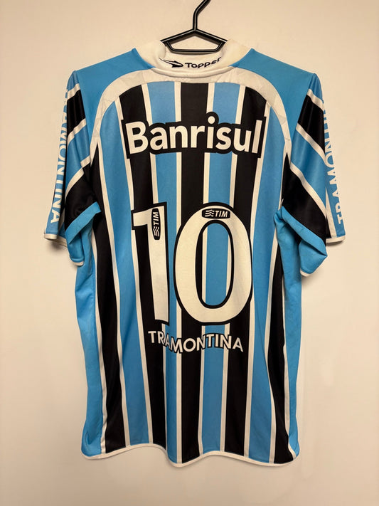 Front view of the Gremio 2011 home shirt showing the Brazilian club crest and Topper logo, shown in full front detail