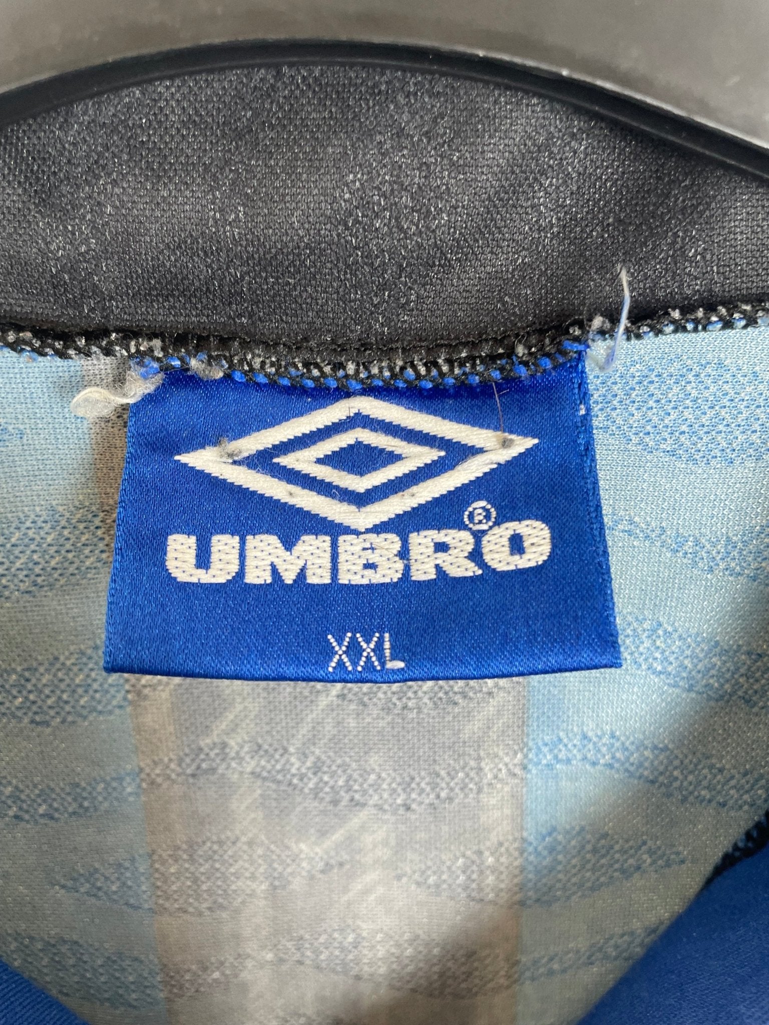 Back of the vintage Inter Milan 1996/97 striped home shirt with the Zanetti number 4 print, shown in full rear detail