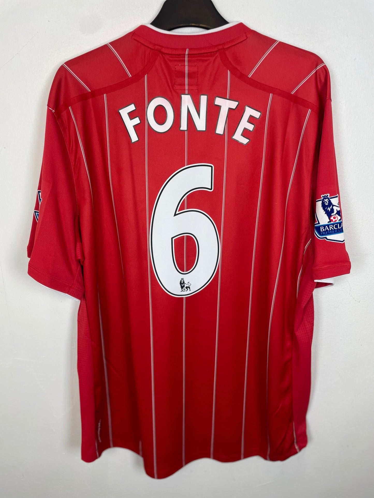Front view of the Southampton 12/13 home shirt showing the Saints crest and Umbro logo, photographed at our Stavanger store