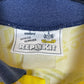 Back of the vintage Tottenham 1991-95 away shirt with the Jurgen Klinsmann number 18 print, shown in full rear detail