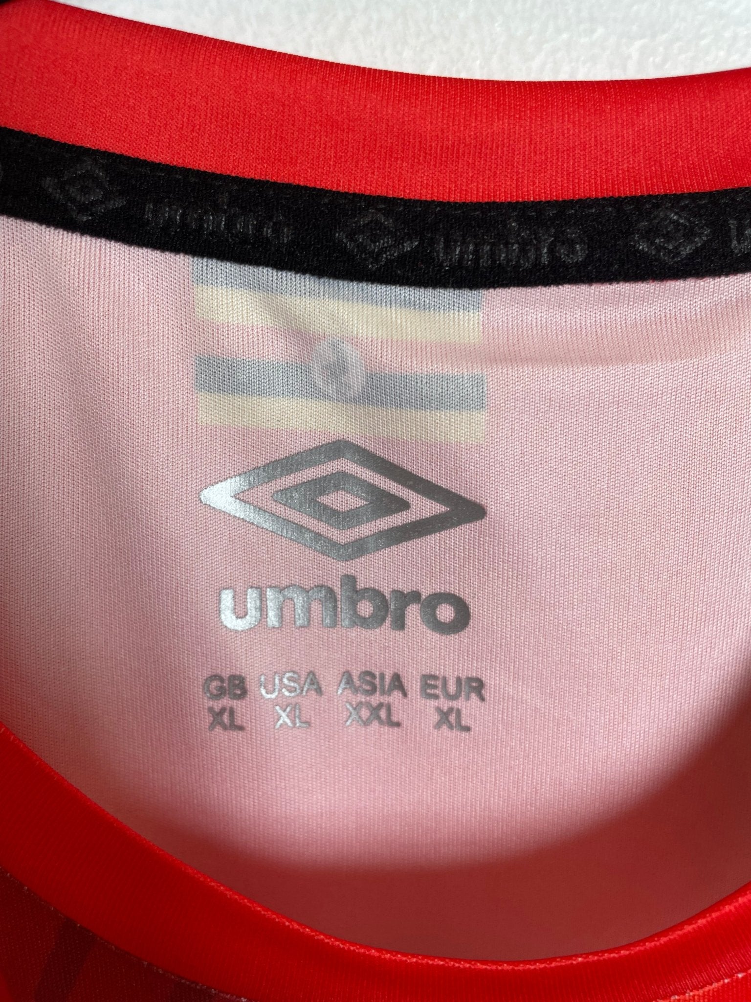 Back of the Umbro Uganda 2021/22 home football shirt without nameset, unworn condition, shown in full rear detail