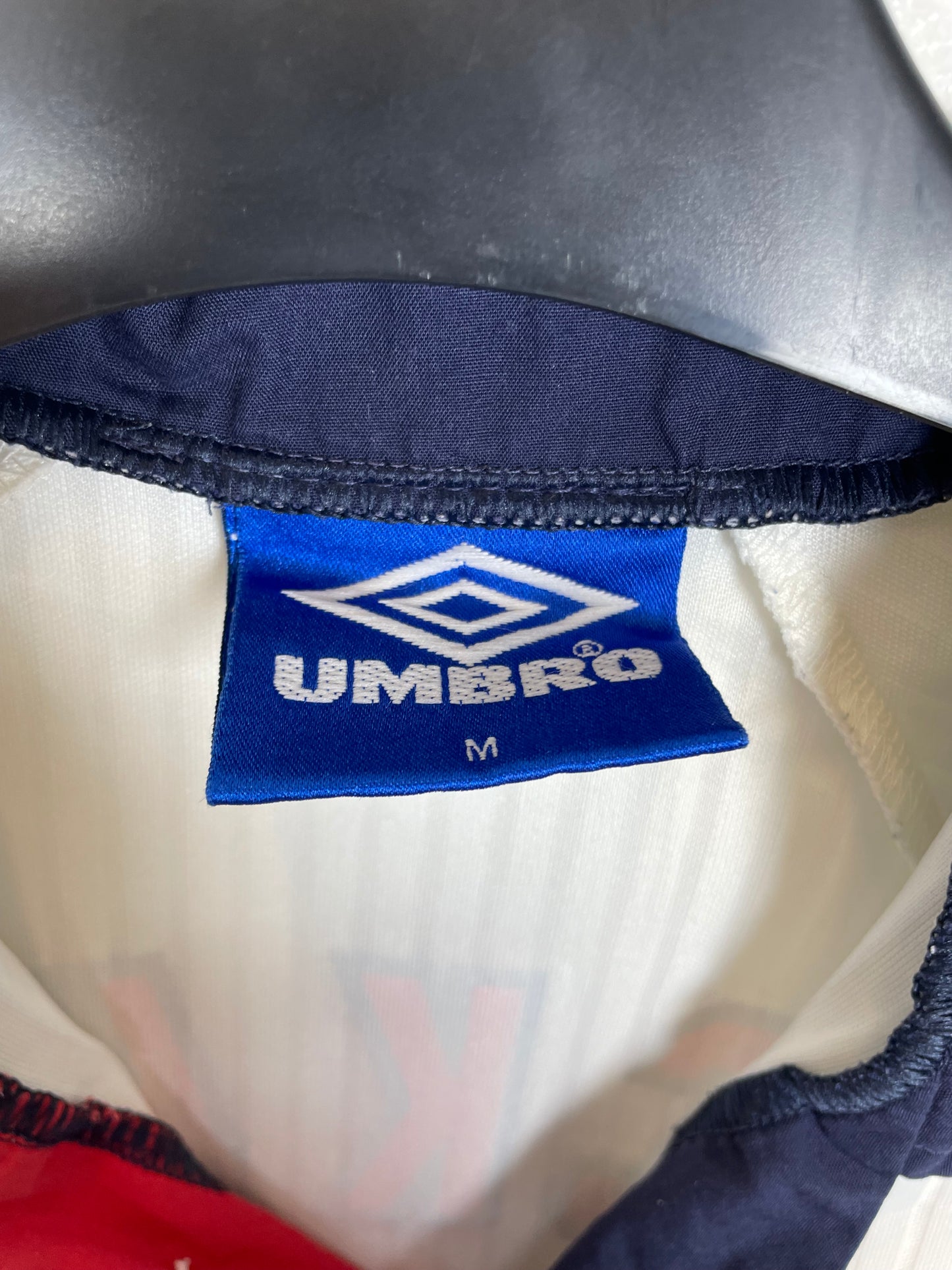 Close-up detail of England 1998 home shirt showing Beckham 7 name and number in excellent condition