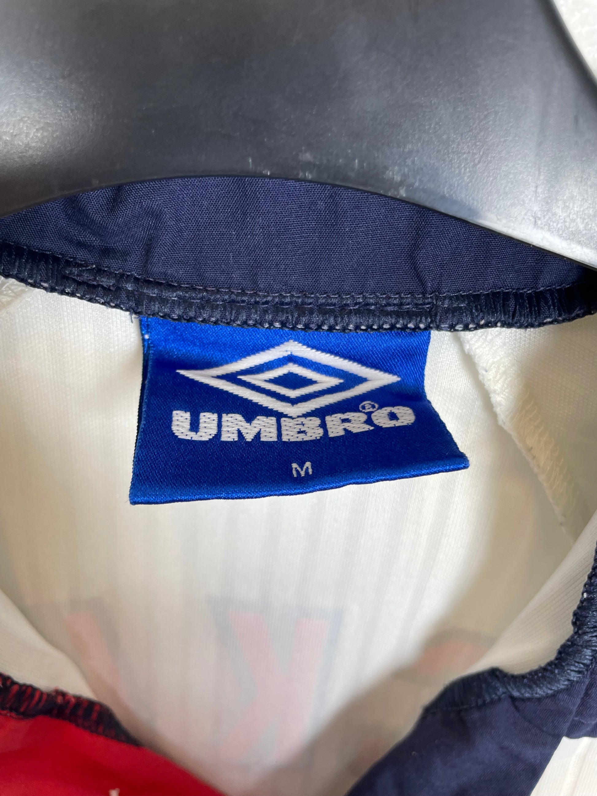 Close-up detail of England 1998 home shirt showing Beckham 7 name and number in excellent condition